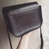 structured black leather box bag